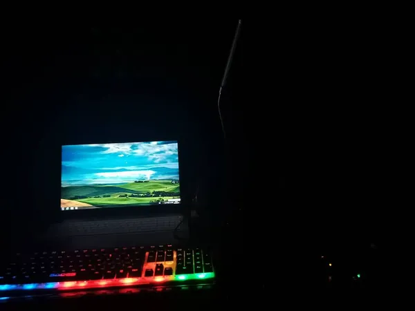 modern computer monitor with a glowing neon light