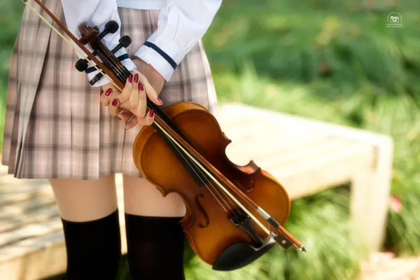 young beautiful woman with violin