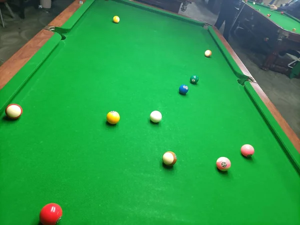 billiard pool with green grass