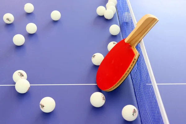 white and blue billiard ball on table with red balls