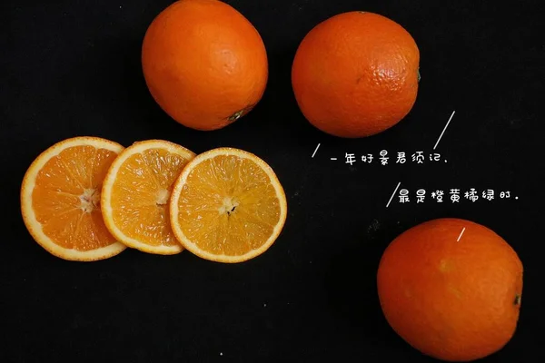 orange and black background with oranges