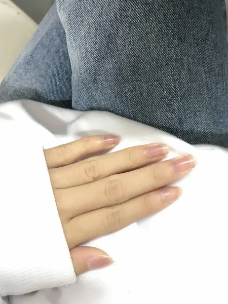 stock image close up of a female hands with a white cloth