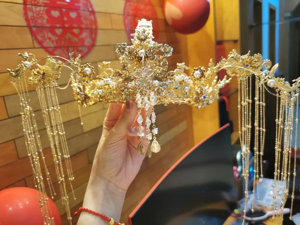christmas decoration in the hands of a woman