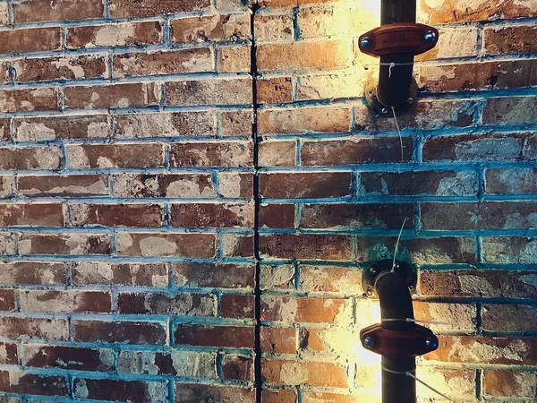 old brick wall with a glass of water