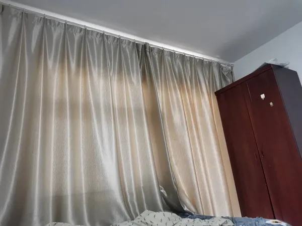white curtains on the wall of the house