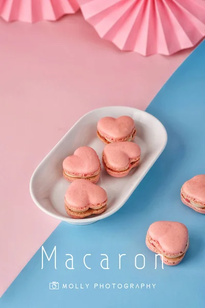 colorful macaroons on a pink background