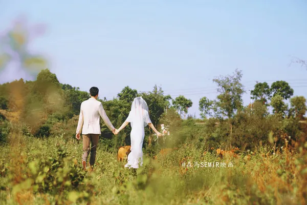young couple in love walking in the field