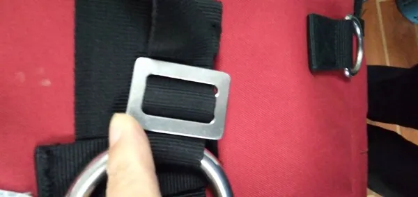 close up of a red leather belt with a buckle