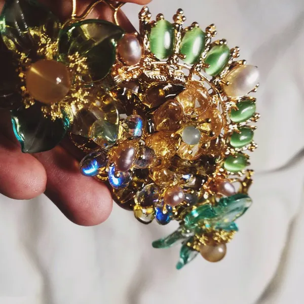 close up of a female hand with a gold jewelry