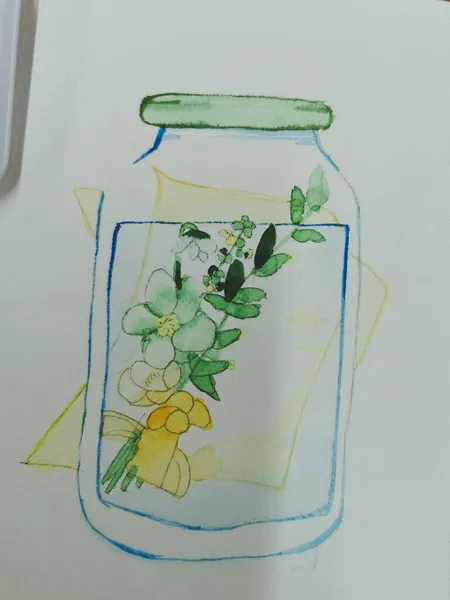 a glass jar with a flower and a bottle of water