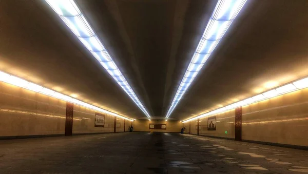 empty underground tunnel with lights and light