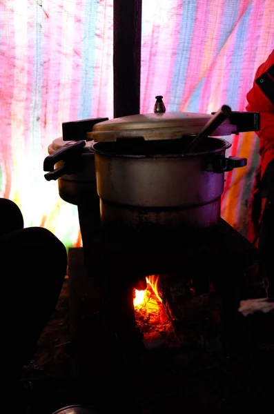 cooking pot with a fire in the kitchen