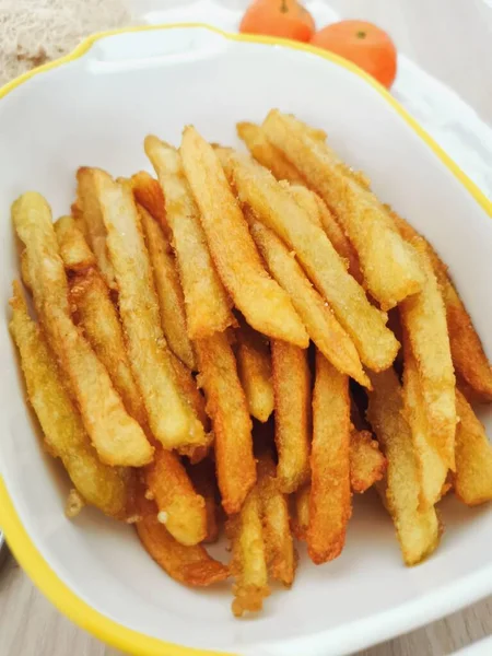 fried potato chips with tomato sauce