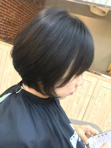 woman with hair dryer in the shop