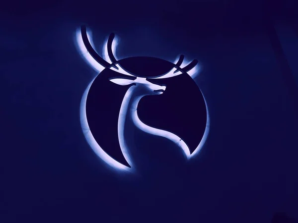 deer head with a horns on a blue background
