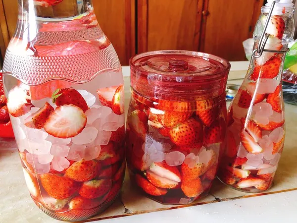 summer lemonade with strawberries and ice cubes