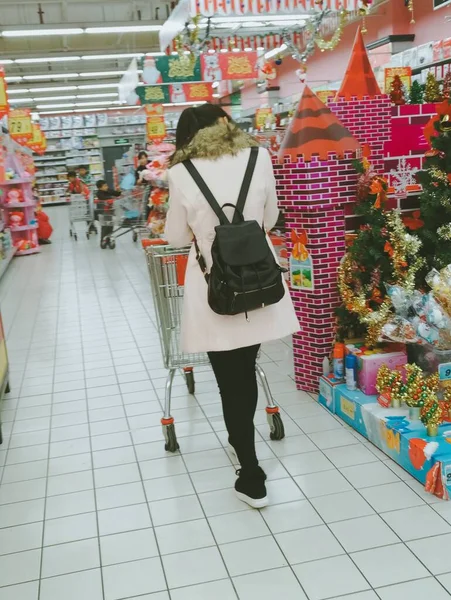 shopping mall, woman with bags and vegetables