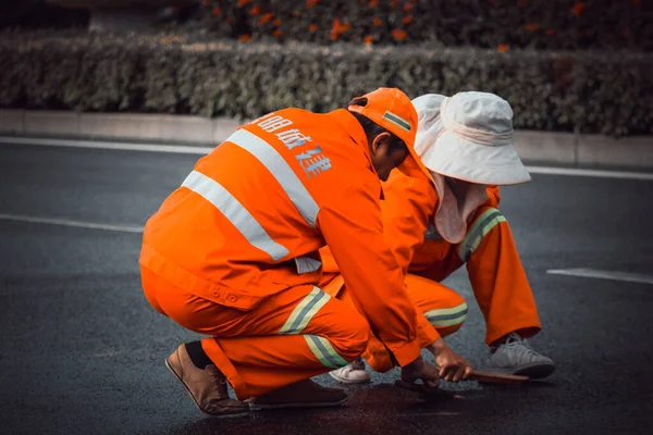 worker in a protective mask and a safety vest