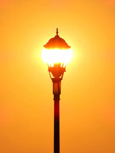 street lamp on the background of the sunset