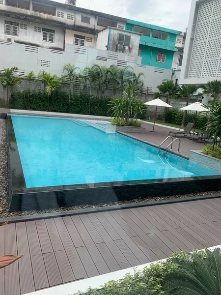 swimming pool with green grass and blue sky