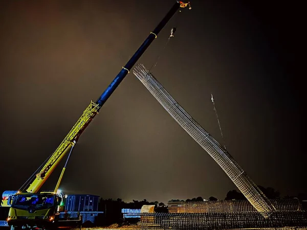 construction crane and building cranes on the background of the night sky