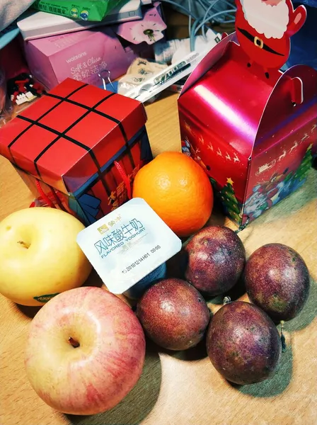 christmas gifts and fruits on the table