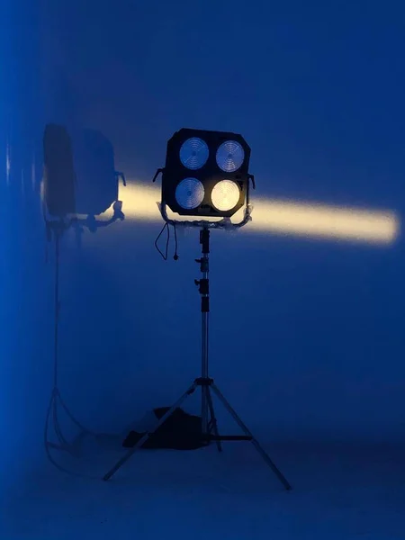 studio lighting equipment, spotlight, stage, light, blue background, copy space