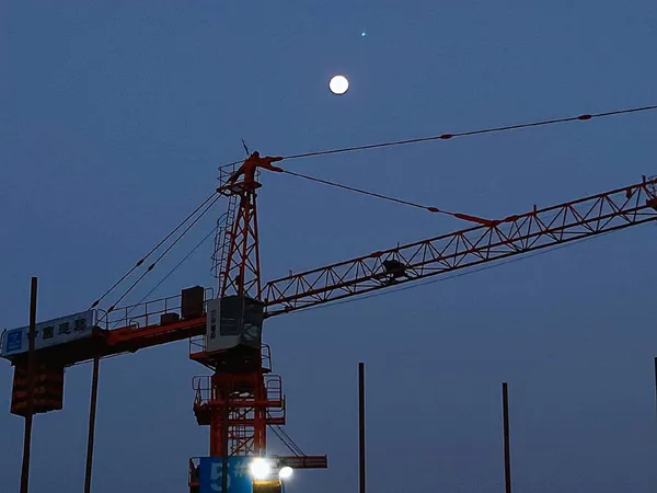 construction crane and building cranes on the background of the sky