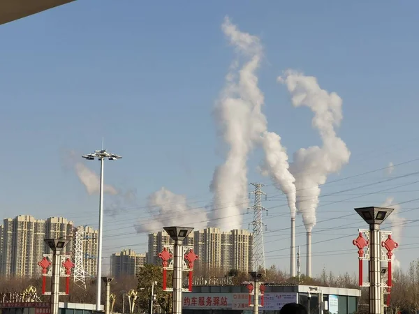 factory building with smoke and chimney