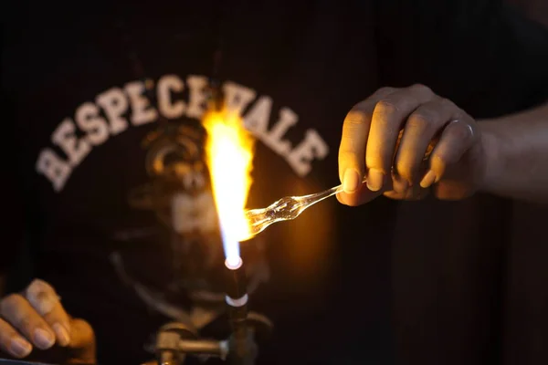 man\'s hands making a fire in the kitchen