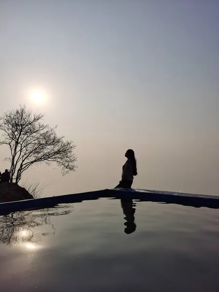 silhouette of a man in a lake