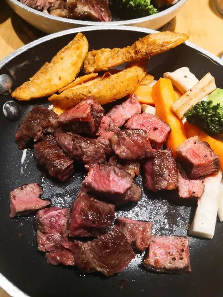 Stock image beef steak with vegetables and sauce