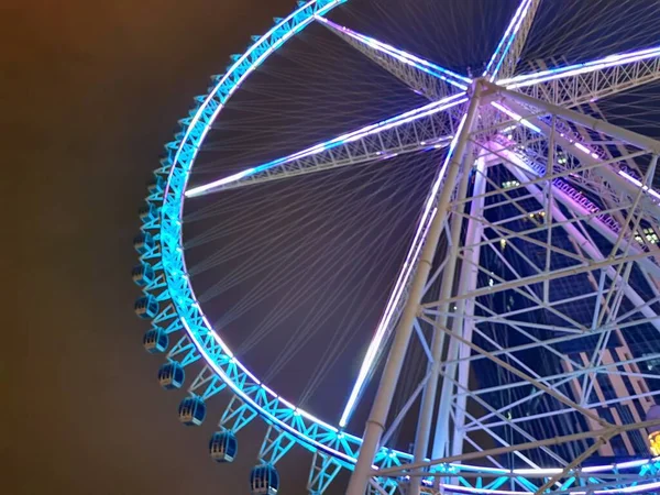 ferris wheel in amusement park, london, uk