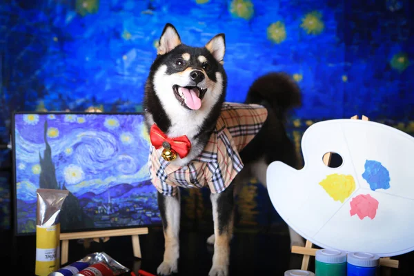 dog with a mask and a blue cup of coffee