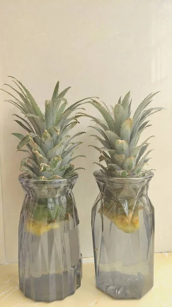 pineapple in glass jar on white background