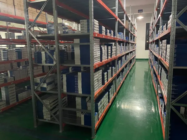 warehouse shelves with boxes in the background