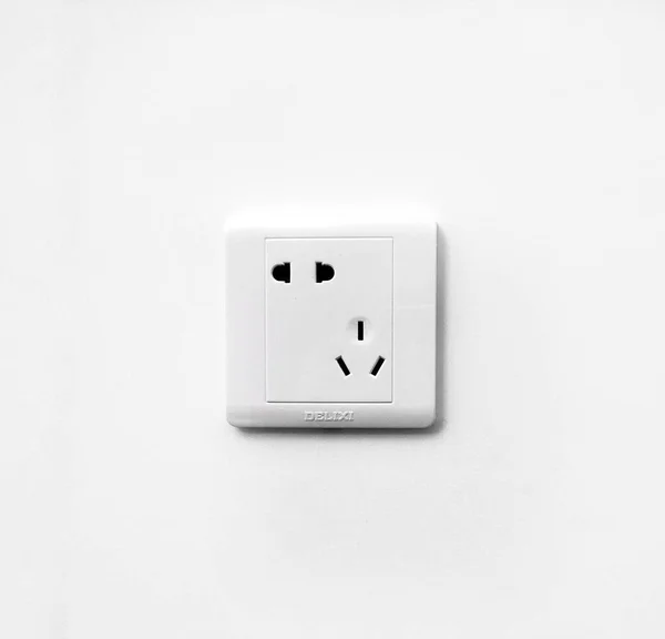 white electrical outlet on a wall