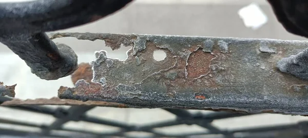 old rusty metal with a saw