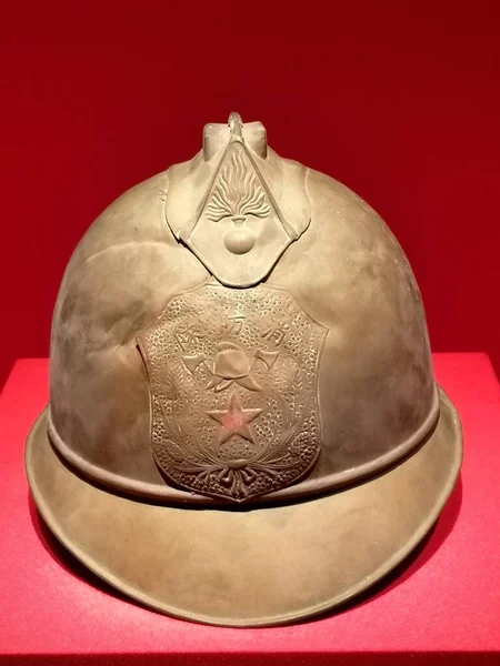 military helmet with a red hat