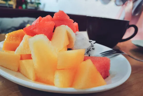 fresh fruit and fruits on a plate