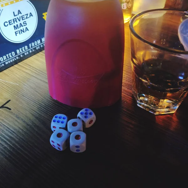 dice and dices on a wooden table