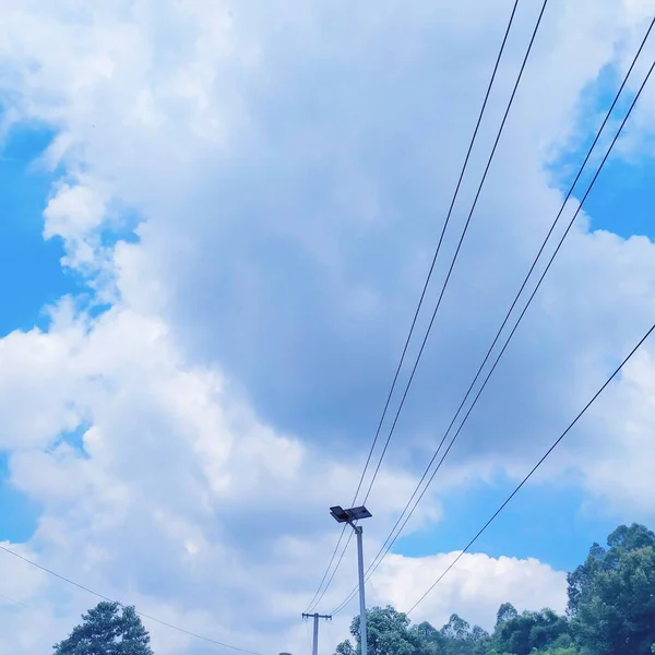 high voltage power lines and blue sky