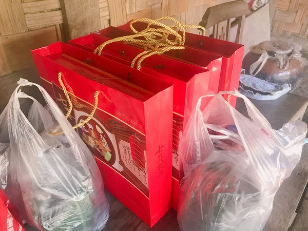 waste bags in a row on a background of a large trash can