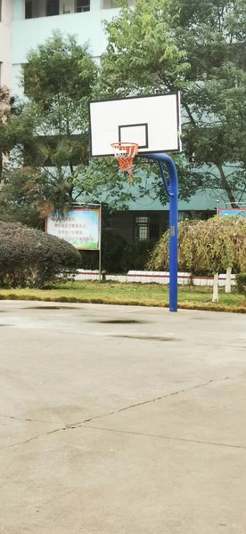 empty basketball court with a white billboard