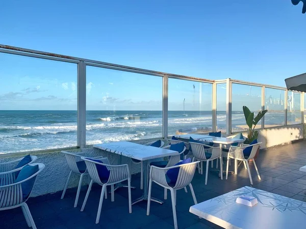 empty cafe with sea view and blue sky