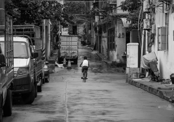 black and white photo of a street in the city