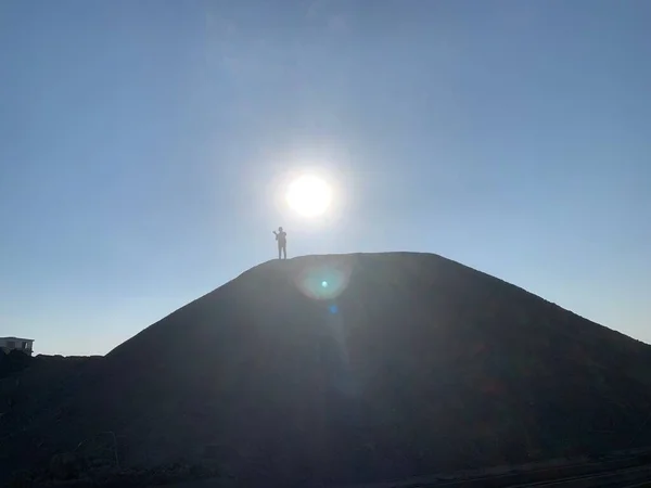 silhouette of a man in a desert