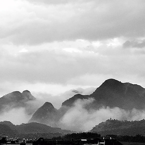 black and white clouds in the mountains