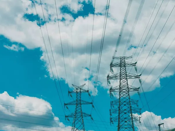 high voltage power lines and blue sky