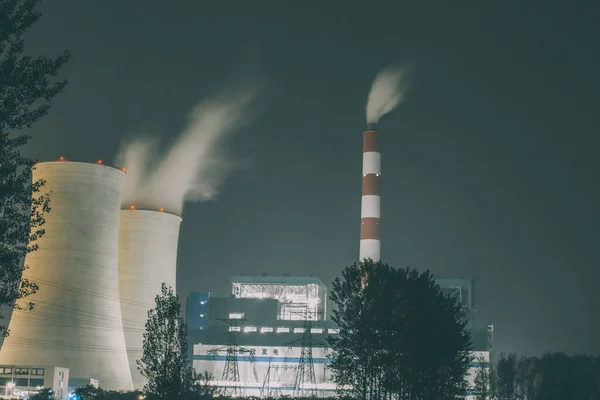 industrial power plant with smoke and chimney